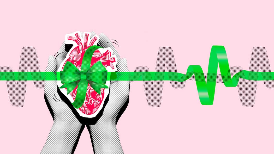 Organe spenden, ja oder nein? Bald müssen Sie entscheiden! Zwei Hände tragen ein Herz mit grüner Schleife vor rosa Hintergrund. Was bei Organspende gilt.