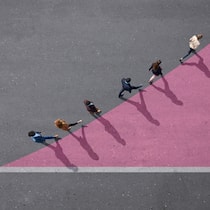Dank Headhuntern mehr Chancen für Frauen Group of young adults, photographed from above, on various painted tarmac surface, at sunrise.