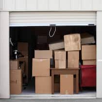 Dank Spenden gehen ihre Möbel nicht verloren Warehouse building with self storage units. Self storage facility. Roll up doors on self storage facility. One door open with boxes and furniture in doorway.
Original File Name: 157676175