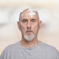 Leben mit dem Vergessen Ein Mann ist als Puzzle dargestellt, in seinem Kopf fehlt wegen Demenz ein Puzzleteil.