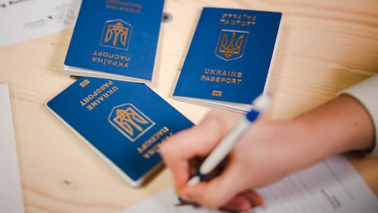 Ukrainian Passports are seen during the registration at the reception center for refugees, following Russia's invasion of Ukraine, in Zurich, Switzerland on March 15, 2022.
