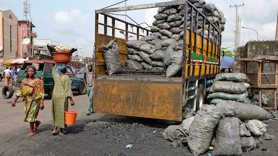 LAGOS, NIGERIA - MARCH 10 : Wood charcoal in a slum in area Sura in Lagos Island on March 10, 2016 in Lagos, Nigeria - West Africa. (Photo by Frédéric Soltan/Getty Images)