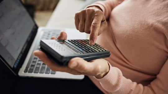 Senior woman calculating. Close up.