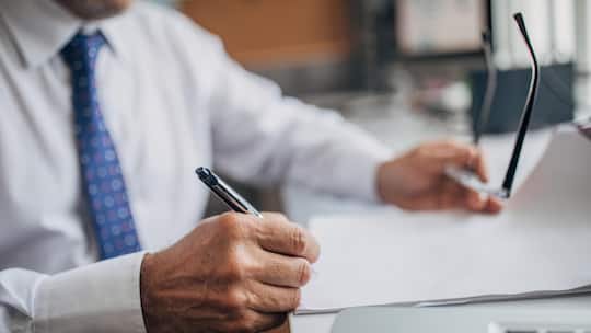 Lawyer signing document in the office