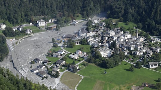 Mud rushes towards the village after another eruption, in Bondo, Graubuenden in South Switzerland, on Friday, August 25, 2017. The village had been hit by a massive landslide on Wednesday. The main road between Stampa and Castasegna is disconnected. …