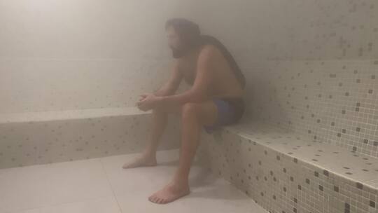 Man Sweating in the Steam Room