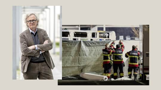 Firemen close off the area with covers in front of the charred shell of a postal bus which caught fire in Kerzers, Switzerland, Tuesday, March 10, 2026. According to the Fribourg cantonal police, several passengers were killed and others injured when…