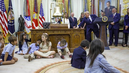 Children sit on the floor as US President Donald J. Trump (not pictured) speaks on the first day of trading for Trump Accounts in the Oval Office of the White House in Washington, DC, USA, 06 July 2026. Trump Accounts grant eligible US children born …