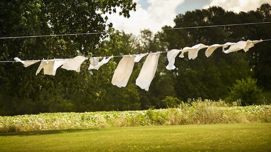 Clothes out to dry on clothespins in the summer breeze