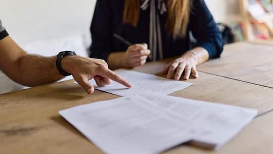 Lawyer reviewing her client's papers