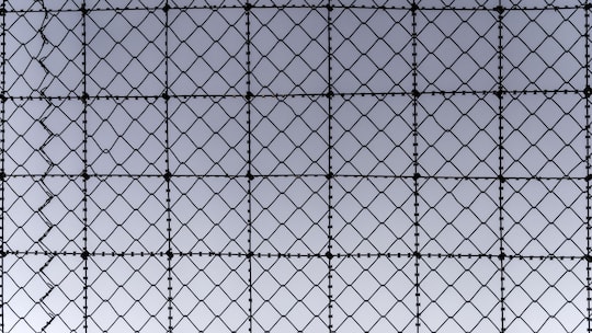 A fence above the outdoor area at the airport prison in Kloten in the canton of Zurich, Switzerland, on January 14, 2016. The airport prison has the departments pretrial detention, corrections and detention pending deportation. (KEYSTONE/Christian Be…